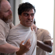 Oscar being restrained